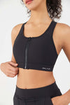 Woman wearing HiTense™ Front Zip Sports Bra showing front zipper and flattering design with wide waistband for secure fit and comfort